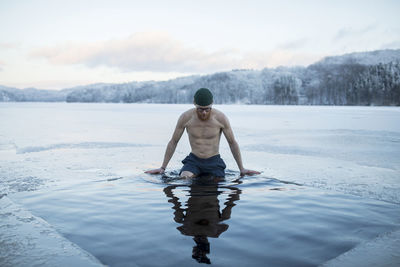 Full length rear view of man in snow