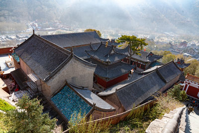 High angle view of roof and buildings in city