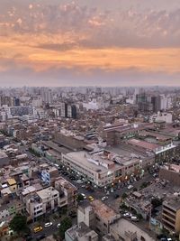 High angle view of buildings against sky during sunset