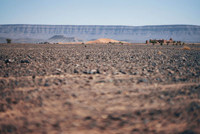 Surface level of land against clear sky