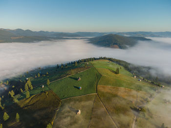 Scenic view of agricultural landscape against sky