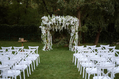 Empty chairs and tables in park