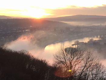 High angle view of river with city in background