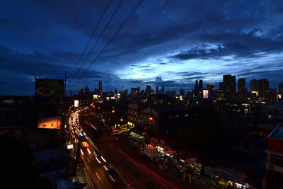 High angle view of light trails on city street at night