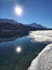 Scenic view of snowcapped mountains against sky during winter