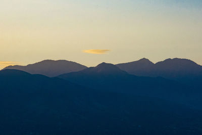 Scenic view of mountains against sky during sunset