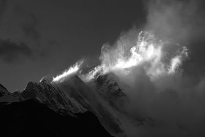 Low angle view of majestic mountains against sky