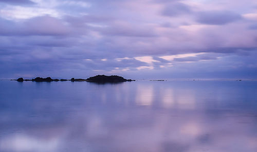 Scenic view of sea against sky at sunset