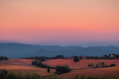 Scenic view of landscape against sky during sunset