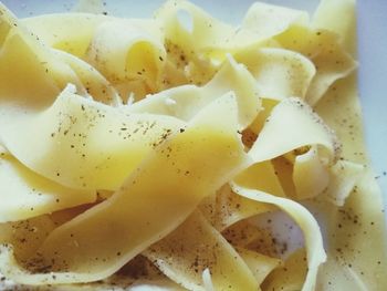 Close-up of yellow noodles in bowl