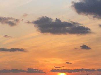 Low angle view of dramatic sky during sunset