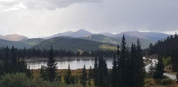 Scenic view of lake and mountains against sky