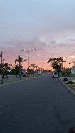 Road against sky at sunset