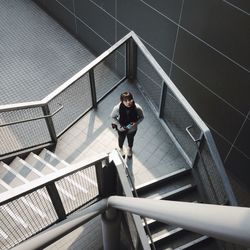 Portrait of woman standing on steps