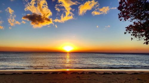 Scenic view of sea against sky at sunset