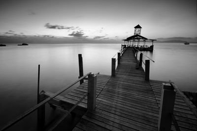 Pier over sea against sky