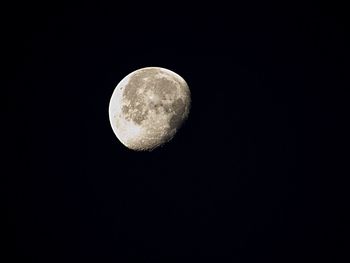 Low angle view of moon against clear sky at night