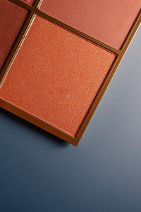 Directly above shot of paper on blue background