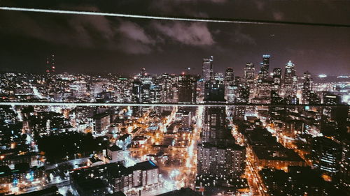 Aerial view of illuminated cityscape at night