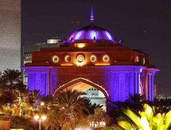 Low angle view of illuminated building at night