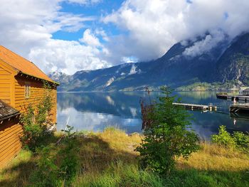 Reflection of the sky and mountains in the blue water