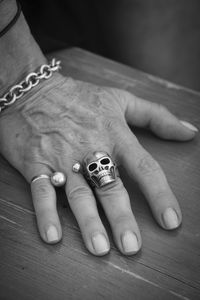 Cropped hand of person on table