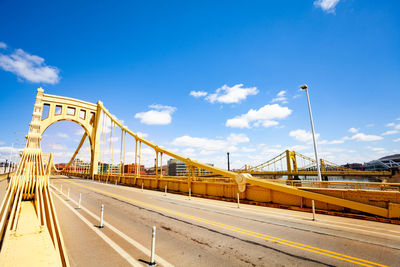 View of bridge against cloudy sky