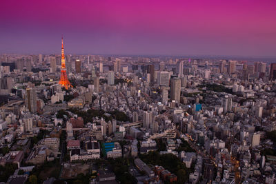 Aerial view of city lit up at night