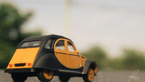 Close-up of toy car on street