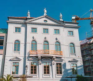 Low angle view of building against blue sky