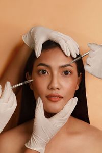 Close-up of female doctor holding syringe