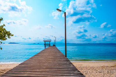 Pier over sea against sky