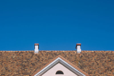 Low angle view of building against blue sky