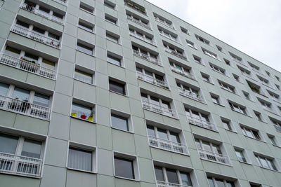 Low angle view of building against sky in city