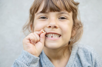 Portrait of smiling girl with broken tooth