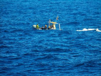 High angle view of ship sailing in sea