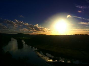 Scenic view of lake at sunset