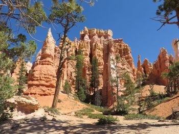 Low angle view of rock formation against sky