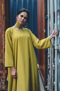 Portrait of beautiful young woman standing outdoors