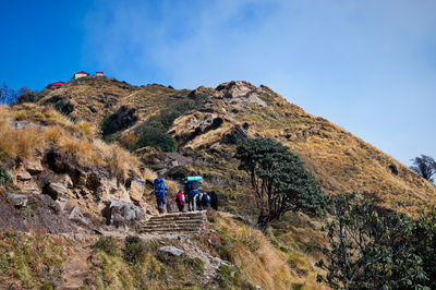 The porters and hikers in himalaya mountains, nepal