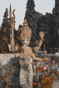 Statue of buddha against building