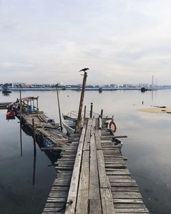 Pier over sea against sky