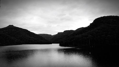 Scenic view of lake with mountains in background