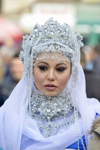 Close-up portrait of woman wearing mask