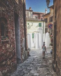 Narrow alley along buildings