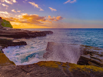 Scenic view of sea against sky during sunset