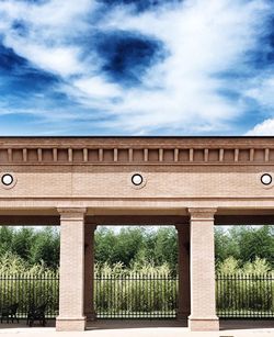 Built structure against cloudy sky