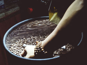 High angle view of person preparing food in container