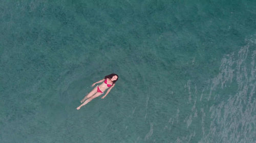 High angle view of woman swimming in water