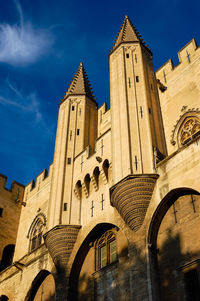 Low angle view of church against blue sky